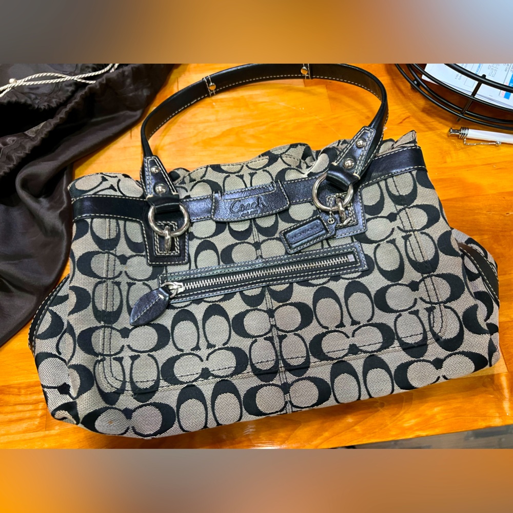 Black and Gray COACH purse with baby blue interior